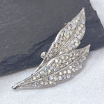 Load image into Gallery viewer, SO SEOUL Ioni Leaf Oversized Natural Double Leaf Aurore Boreale Crystal Rollover Clasp Brooch