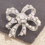 Load image into Gallery viewer, SO SEOUL Lifelong Oversized Ribbon Bow Aurore Boreale Crystal Rollover Clasp Brooch