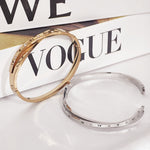 Load image into Gallery viewer, SO SEOUL Roman Numeral Intertwine Encrusted Diamond Simulant Rhodium/Rose Gold Side Hinged Bangle