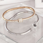 Load image into Gallery viewer, SO SEOUL Aurelia Rolling Barrel White Austrian Crystal Middle Screw Clasp Hinged Rose Gold Bangle