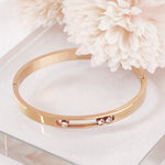 Load image into Gallery viewer, SO SEOUL Aurelia Triple Rolling Diamond Simulant Cubic Zirconia Rose Gold Side Hinged Bangle