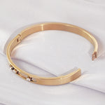 Load image into Gallery viewer, SO SEOUL Aurelia Triple Rolling Diamond Simulant Cubic Zirconia Rose Gold Side Hinged Bangle