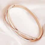 Load image into Gallery viewer, SO SEOUL Harper Twist Intertwined Insets White Austrian Crystal Rose Gold Side Hinged Bangle
