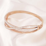 Load image into Gallery viewer, SO SEOUL Harper Twist Intertwined Insets White Austrian Crystal Rose Gold Side Hinged Bangle