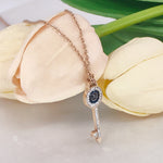 Load image into Gallery viewer, SO SEOUL Infinite Love Key Tied Knot White/Montana Austrian Crystal Rose Gold Fixed Chain Necklace