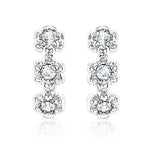 Load image into Gallery viewer, SO SEOUL Harley Huggie Triple Flower Diamond Simulant Hoop Clip Earrings
