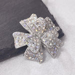 Load image into Gallery viewer, SO SEOUL Graceful Ribbon Bow 3D Layered Oversized Aurore Boreale Crystal Rollover Clasp Brooch
