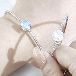 Load image into Gallery viewer, SO SEOUL Carina Cushion Moonlight/Light Sapphire Shimmer Swarovski® Crystal Spiral Open-End Bangle
