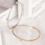 Load image into Gallery viewer, SO SEOUL Athena Round Solitaire Brilliant Cut Bezel Diamond Simulant Cubic Zircon Side Hinged Bangle
