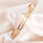 Load image into Gallery viewer, SO SEOUL Aurelia Triple Rolling Diamond Simulant Cubic Zirconia Rose Gold Side Hinged Bangle
