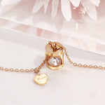 Load image into Gallery viewer, SO SEOUL Eleanor Hourglass Necklace – Rose Gold Chain with Side Heart &amp; CZ Diamond Simulant Charm