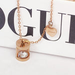 Load image into Gallery viewer, SO SEOUL Eleanor Hourglass Necklace – Rose Gold Chain with Side Heart &amp; CZ Diamond Simulant Charm