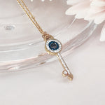 Load image into Gallery viewer, SO SEOUL Infinite Love Key Tied Knot White/Montana Austrian Crystal Rose Gold Fixed Chain Necklace